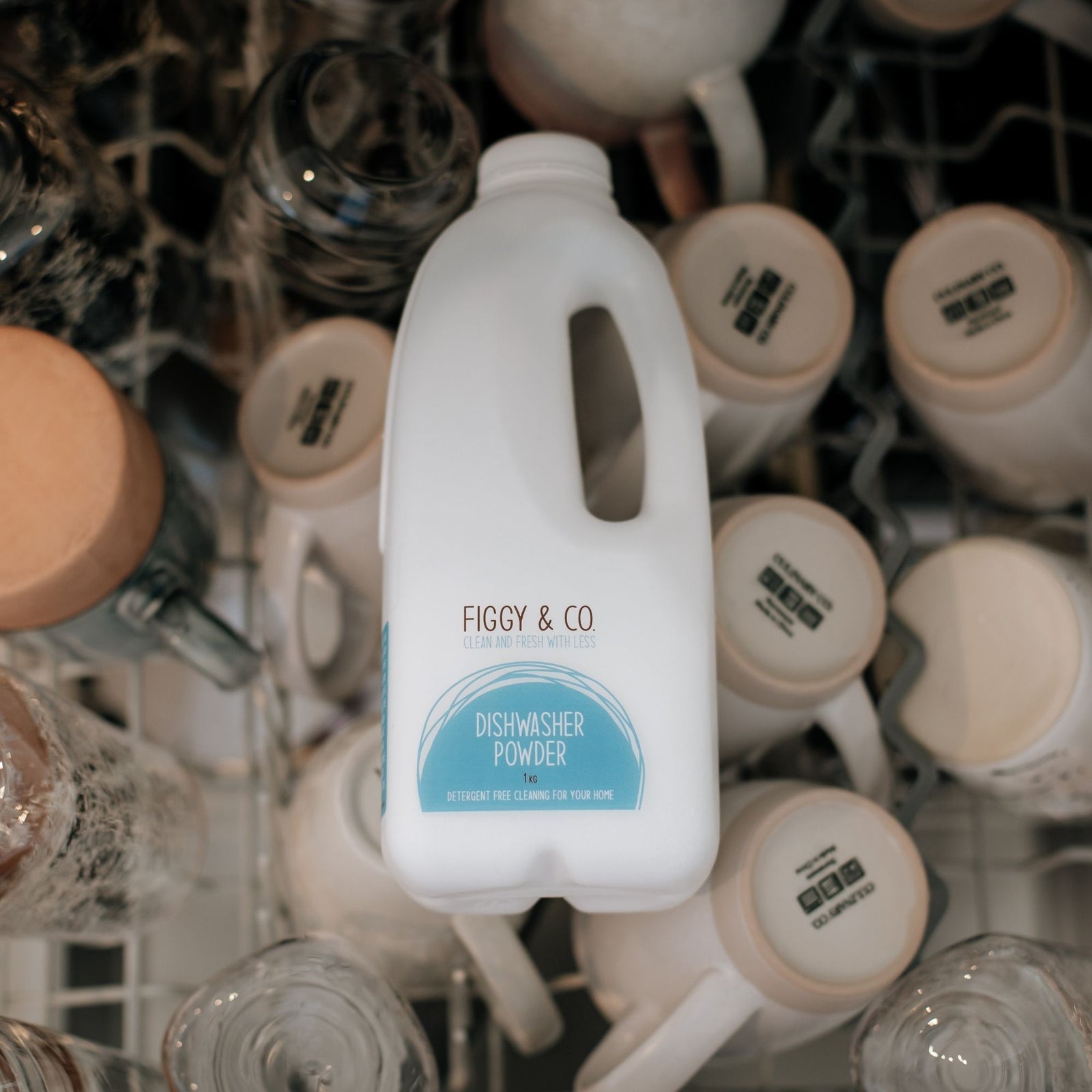 Figgy and Co Dishwasher Powder Sitting Among dishes